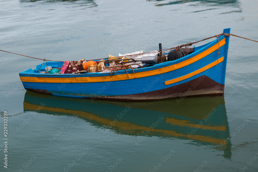 Small wooden boat in the bay, Rabat, Morocco Small wooden boat in the bay, Rabat, Morocco