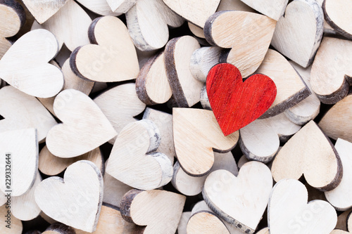 Background with wooden hearts, place for text.