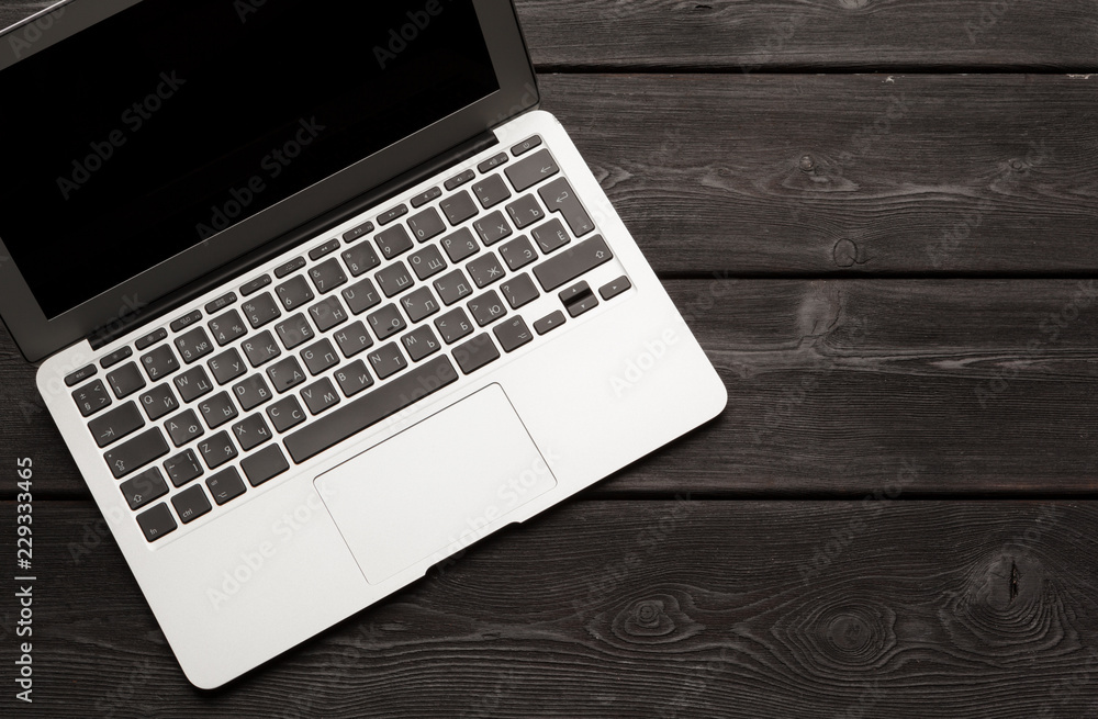 Top view of modern laptop on wooden desk Top view of modern laptop on wooden desk