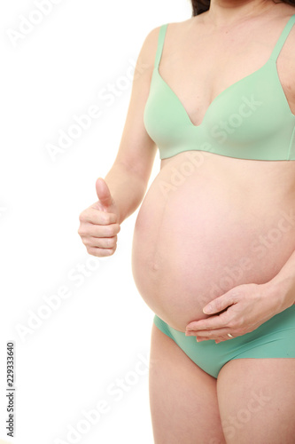 Wallpaper Mural 妊娠の経過が順調な緑色の下着を着た臨月の妊婦 Torontodigital.ca