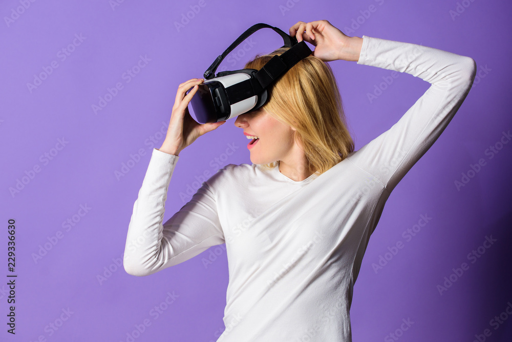Girl use modern technology vr headset. Enjoy virtual reality. Woman hold vr headset glasses violet background. Digital device and modern opportunities. Virtual reality and future technologies Girl use modern technology vr headset. Enjoy virtual reality. Woman hold vr headset glasses violet background. Digital device and modern opportunities. Virtual reality and future technologies