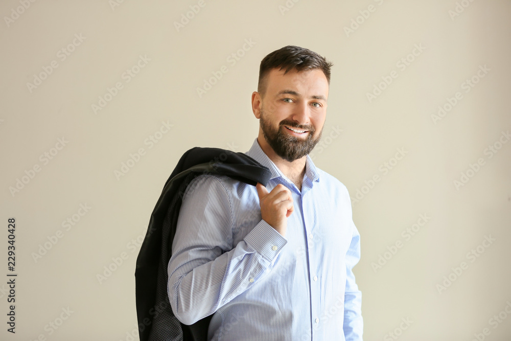 Portrait of handsome businessman on light background Portrait of handsome businessman on light background