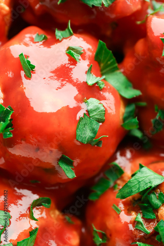 Savory meatballs in rich to...