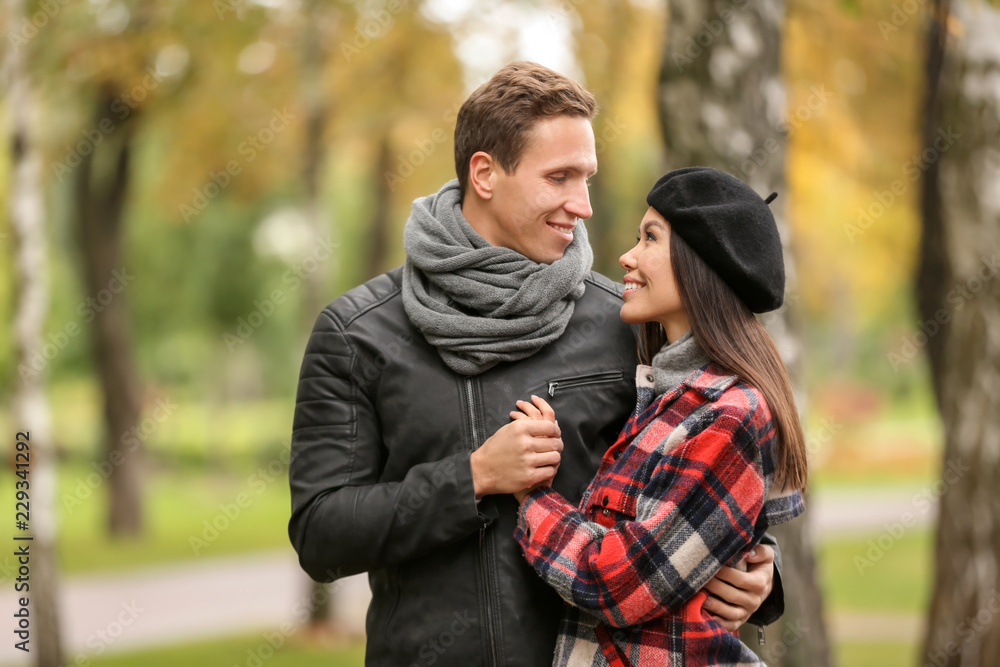 Loving young couple on romantic date in autumn park Loving young couple on romantic date in autumn park