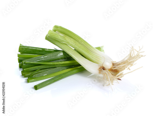 fresh spring onions isolated on a white background