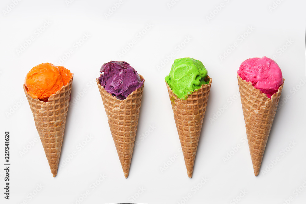 Waffle cones with delicious color ice cream on white background Waffle cones with delicious color ice cream on white background