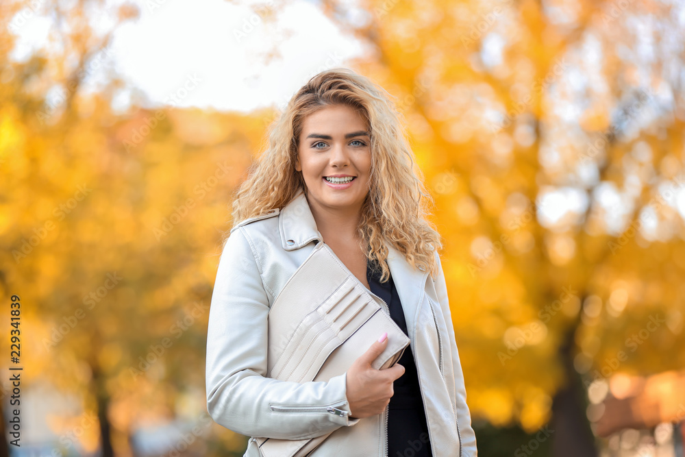 Fashionable young woman in park Fashionable young woman in park