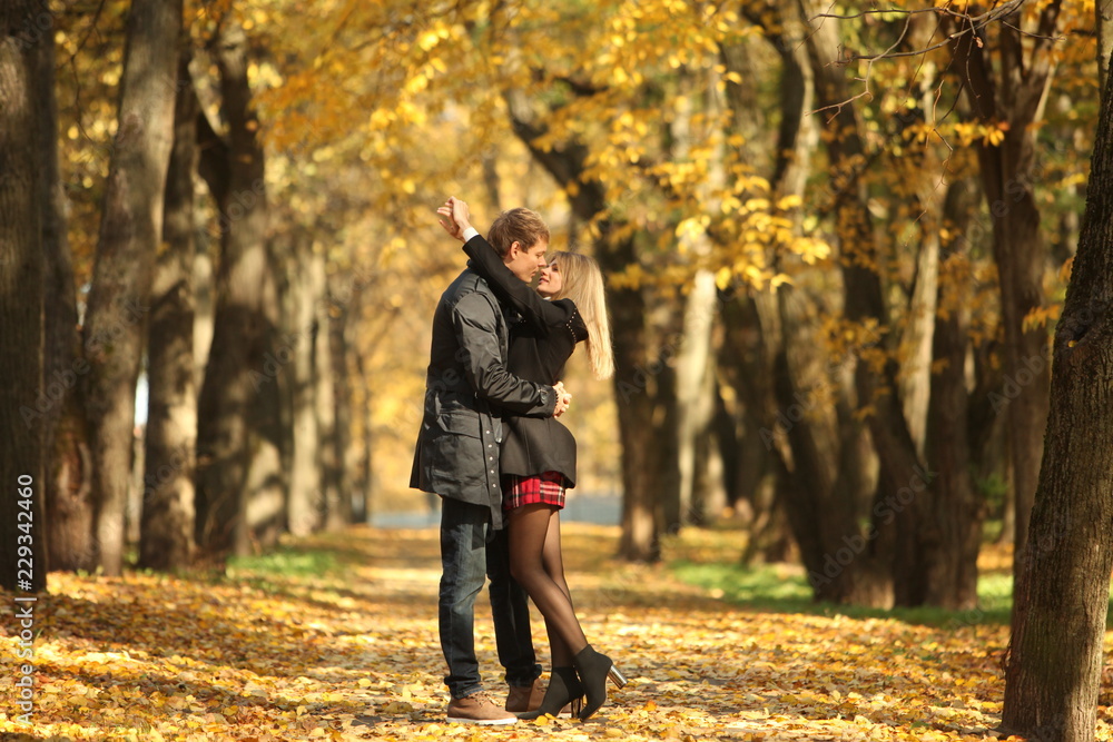 couple people young man and women walking autumn park fanny sunny day