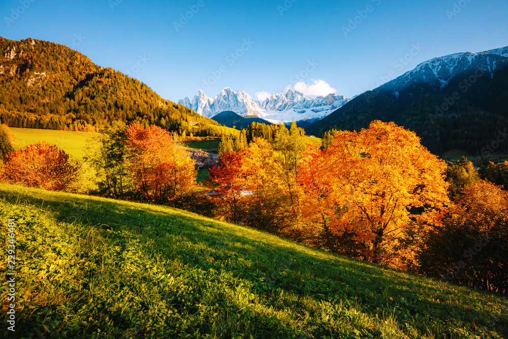 Magic image of sunny hills in St. Magdalena village. Location Funes valley, Dolomiti Alps. Province of Bolzano, South Tyrol, Italy. Europe. Magic image of sunny hills in St. Magdalena village. Location Funes valley, Dolomiti Alps. Province of Bolzano, South Tyrol, Italy. Europe.
