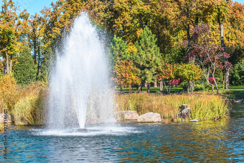 Fountain on the lake in the landscape park Mezhigirya near Kiev, Ukraine.