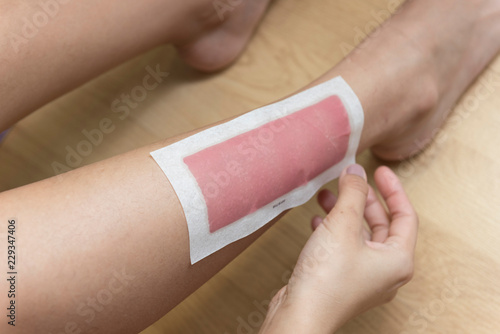 Woman using Wax pad for skin beauty