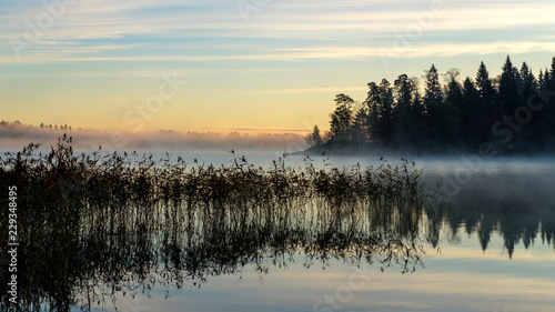 Autumn sunrise by the lake