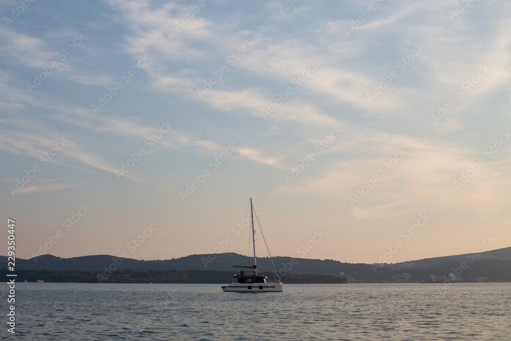 Yacht in the sea departs from the shore. Сopyspace for text.