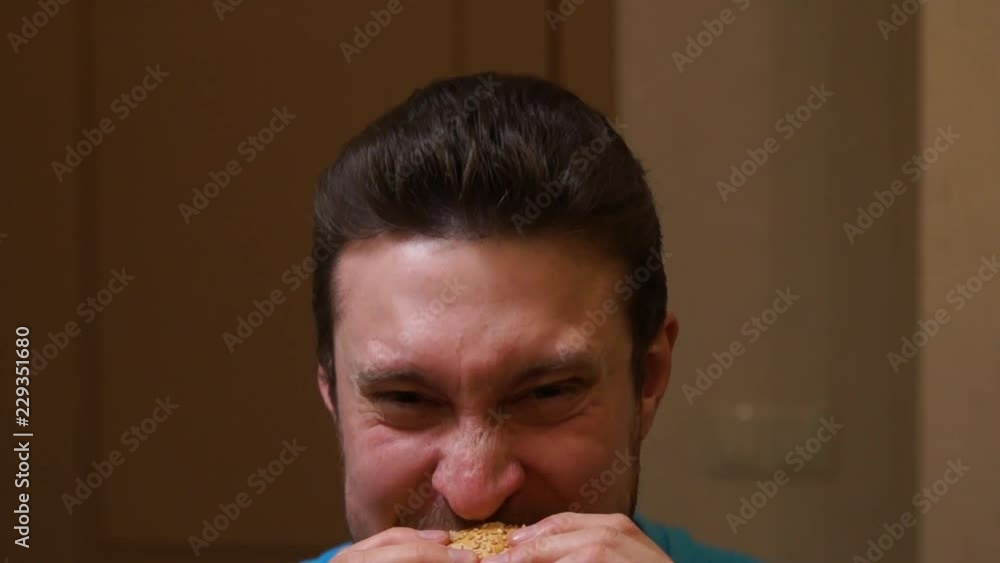 Man eating burger. Fast food. Junk food. Hamburger. Man eats a hamburger Man eating burger. Fast food. Junk food. Hamburger. Man eats a hamburger