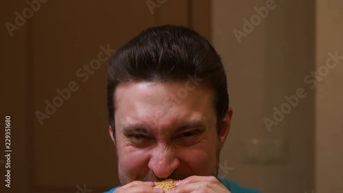 Man eating burger. Fast food. Junk food. Hamburger. Man eats a hamburger photo