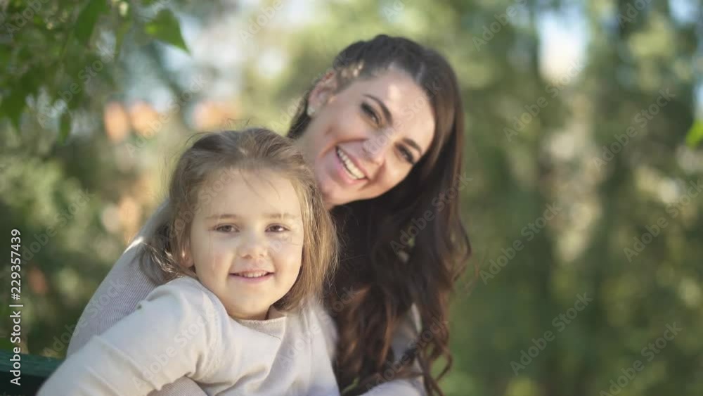 Little blond girl and her mother are laughing together Little blond girl and her mother are laughing together