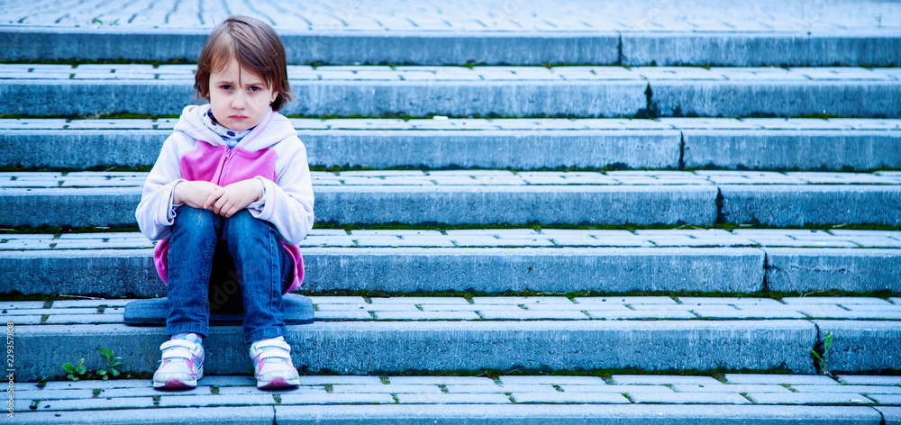 Portrait of little cute child girl expressing sadness and loneliness. Gestures, body language, facial expressions, depression concept. Portrait of little cute child girl expressing sadness and loneliness. Gestures, body language, facial expressions, depression concept.