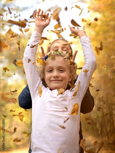 kids play in park with leafs