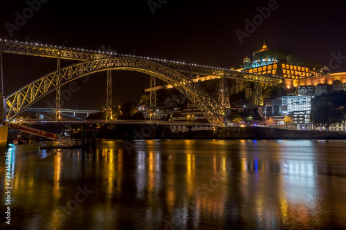 Night landscape of the city of Porto on the Douro River, overlooking the bridge of San Luis and the monastery. © sergojpg