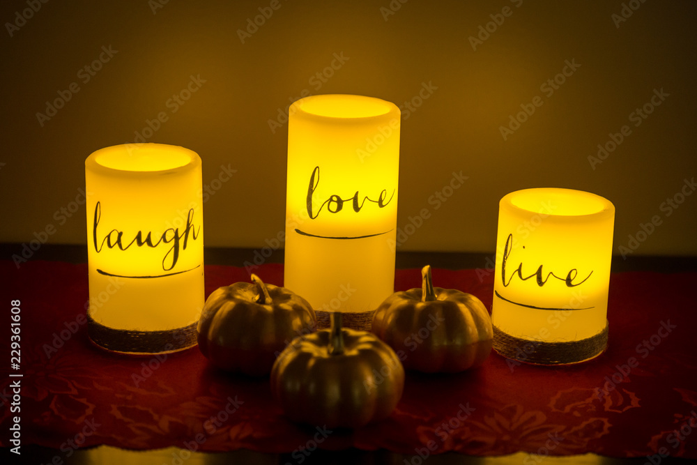 Live. Love. Laugh. Beautiful Candles light the scene. Live. Love. Laugh. Beautiful Candles light the scene.