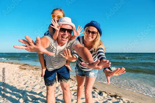 funny happy family on the beach