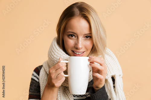 Close up portrait of a happy girl dressed in sweater