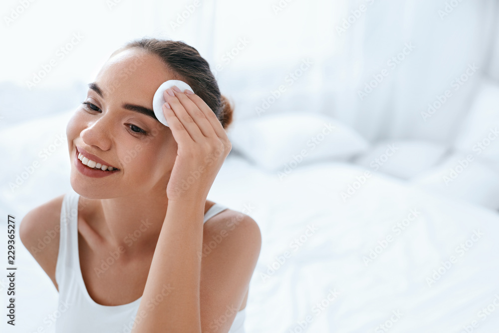 Clean Face. Beautiful Woman Cleaning Skin With Cosmetic Pad
