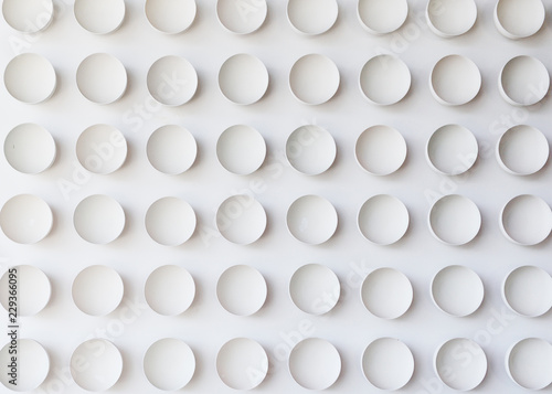 lots of white round plates or cups on white background - texture or background. © Evgeniy Kalinovskiy
