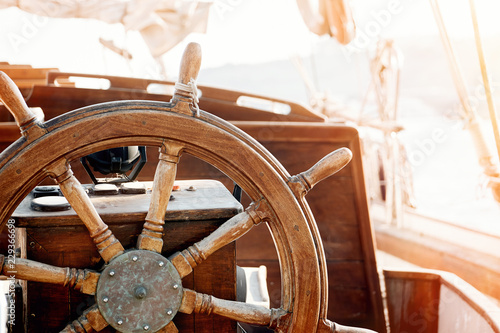 Steering wheel of an old ship. photo