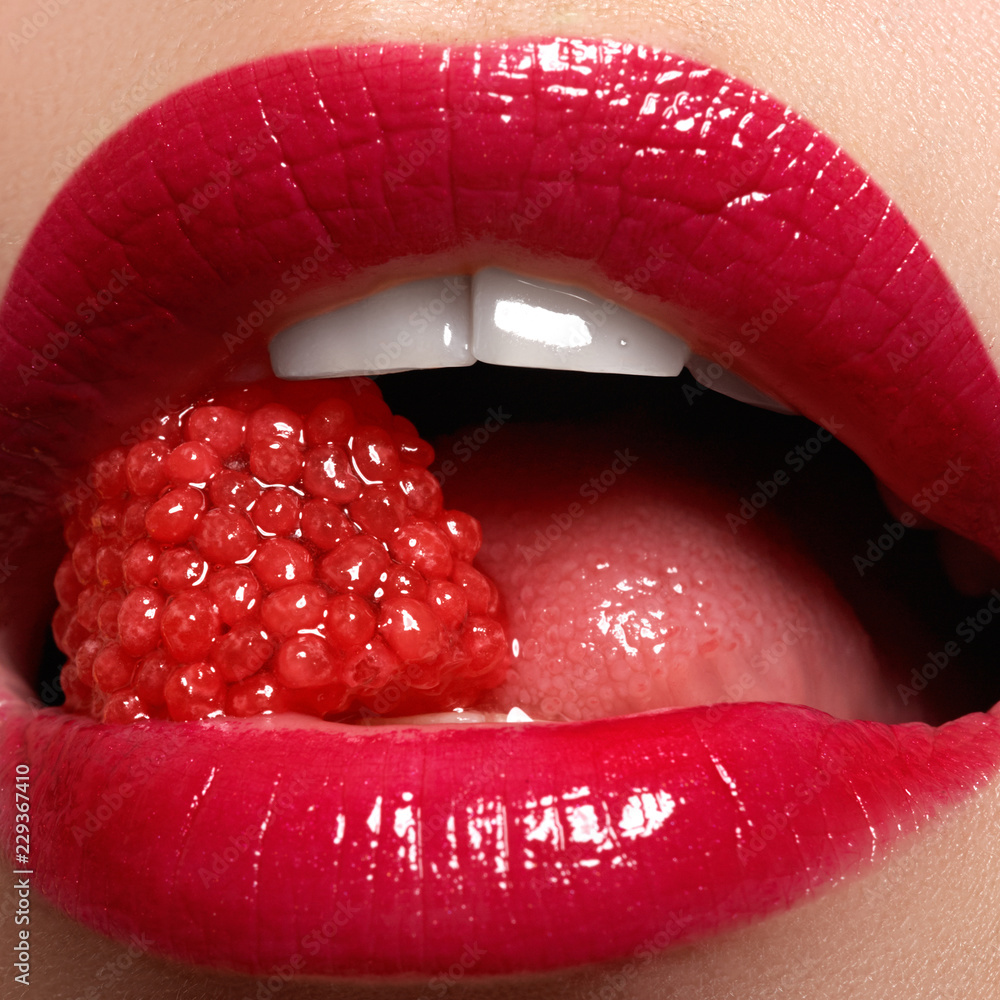 Close-up of woman's lips with bright fashion red glossy makeup. Macro  bloody lipgloss make-up. Red sexy lips. Open mouth. Manicure and makeup.  Beauty products concept. – Stock-Foto | Adobe Stock