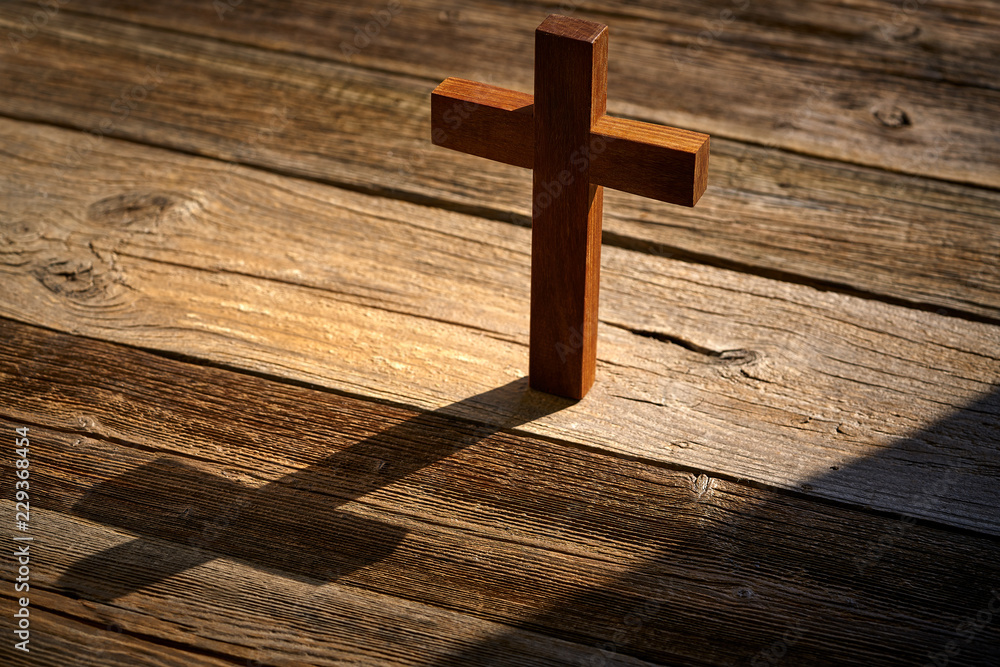 Christian cross on wood over wooden