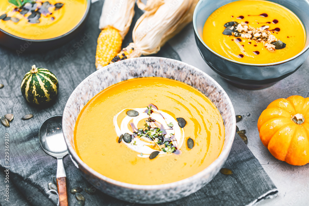 Roasted pumpkin and carrot soup with cream and pumpkin seeds Roasted pumpkin and carrot soup with cream and pumpkin seeds