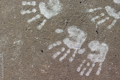Print on the road. Chilfdren hands. Copy space