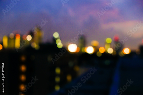 Abstract blurred light of modern city with colorful sky © themorningglory