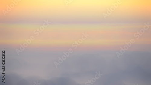 Blurred Sunrise Background, Early Morning Light, The Natural Lighting Phenomena. © areeya_ann