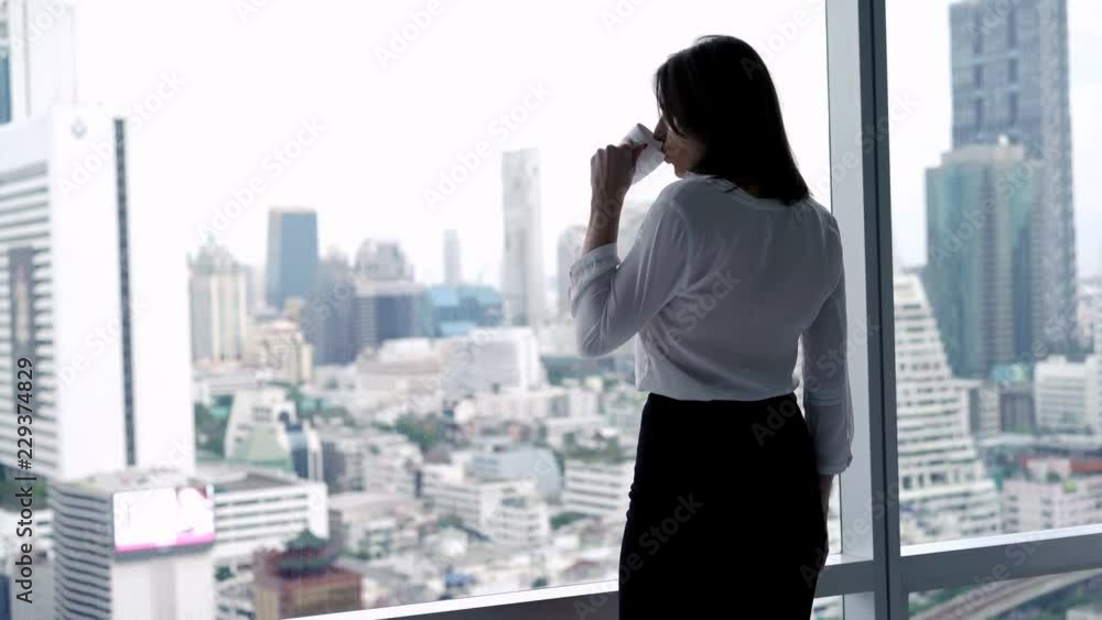 Young businesswoman drinking coffee and relaxing by window in the office, 4K
Young businesswoman drinking coffee and relaxing by window in the office, 4K