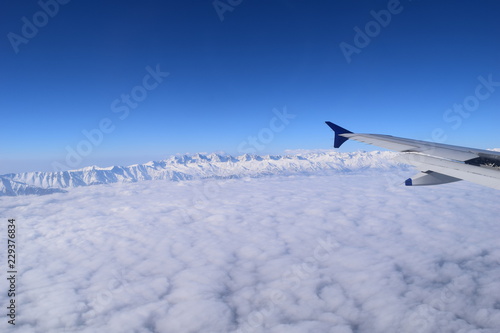 snow and clouds from the plane