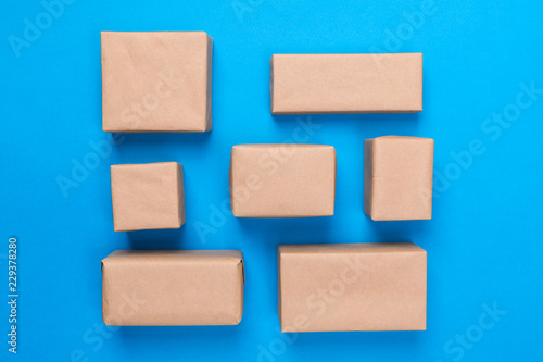 a lot of cardboard box on blue wooden background. top view