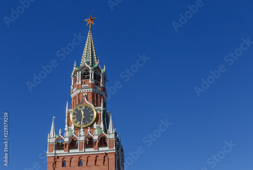 Spasskaya Tower of Moscow Kremlin against blue sky, Russia