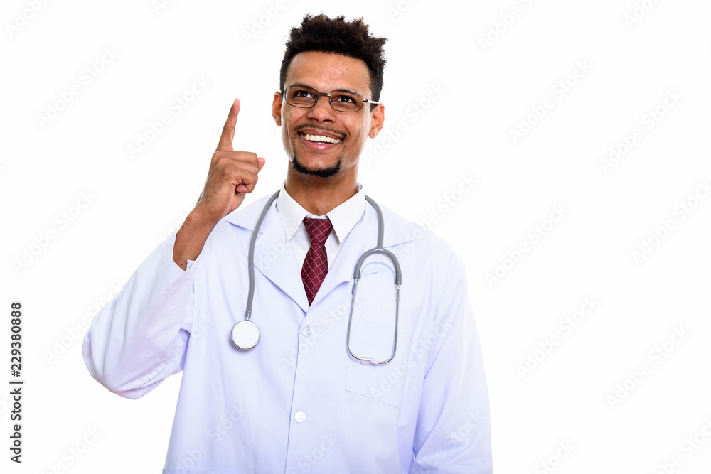 Thoughtful happy African man doctor smiling while pointing finge Thoughtful happy African man doctor smiling while pointing finge