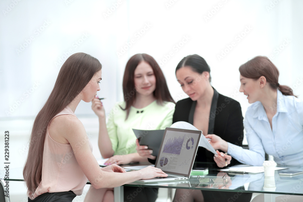 business team discussing a financial report at the office business team discussing a financial report at the office