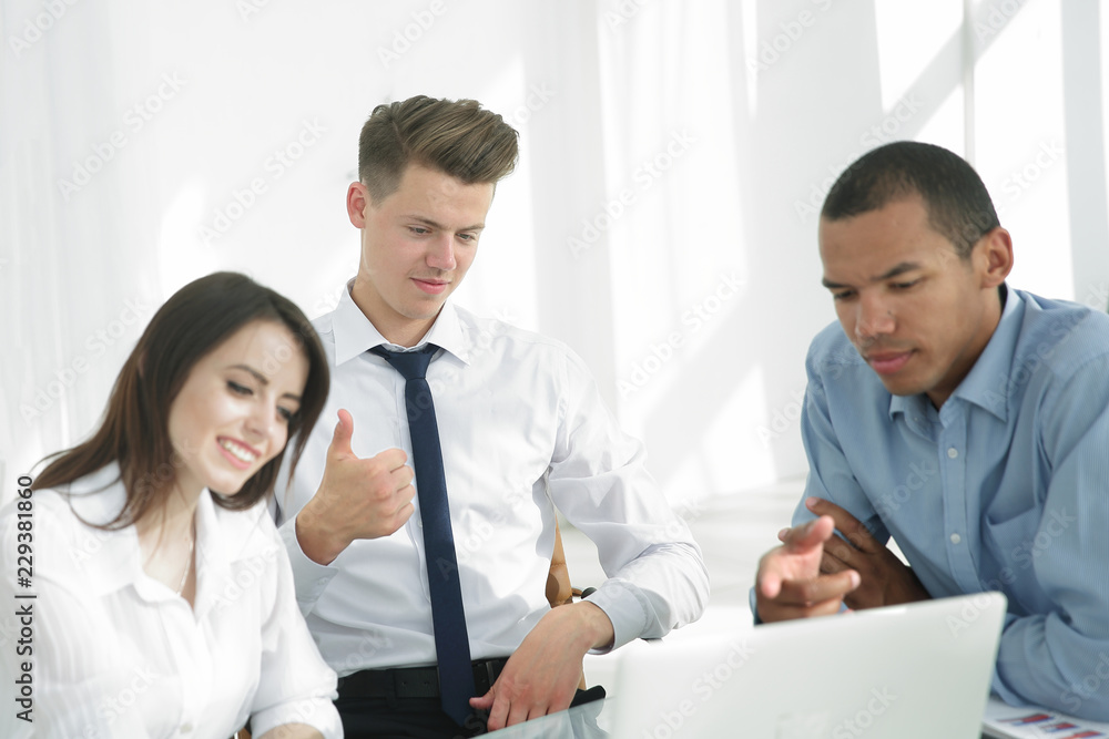 business team discussing business issues in office. business team discussing business issues in office.