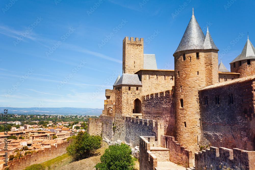 Old Carcassonne city with its towers over blue sky