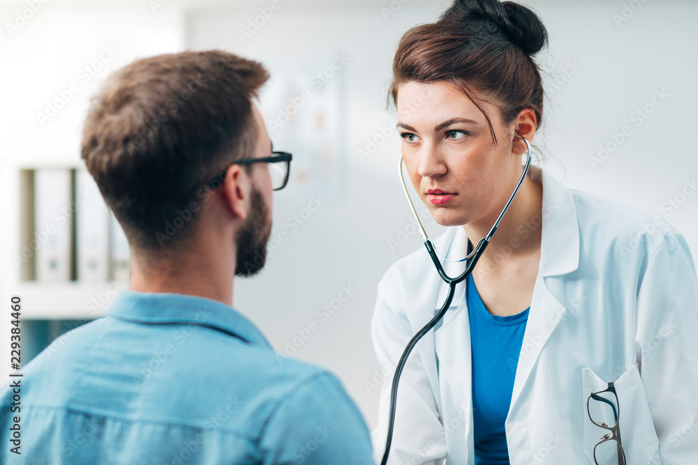 Woman Doctor Performing Stethoscope Check Up Woman Doctor Performing Stethoscope Check Up