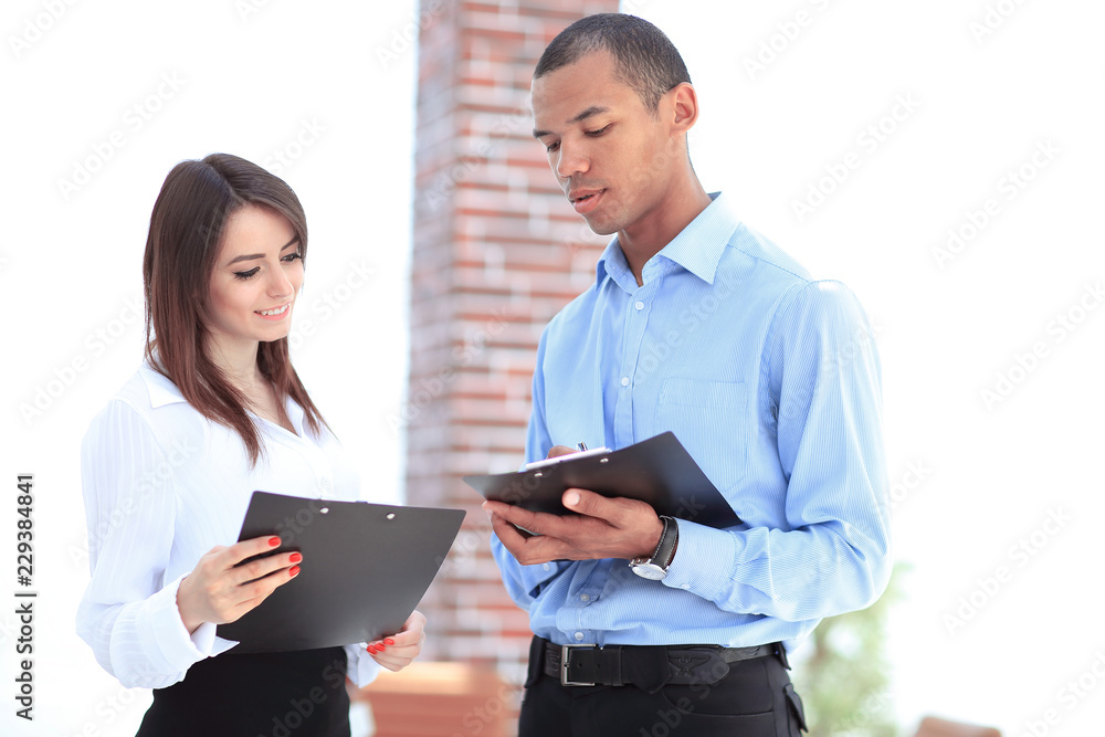 businessman and the employee discussing work schedule. businessman and the employee discussing work schedule.
