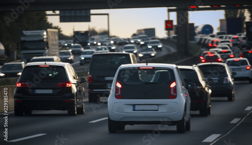 stream of cars, congestion and traffic jam at rush hour on the freeway at dusk © Maren Winter