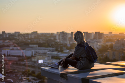 woman siting on the roof photo