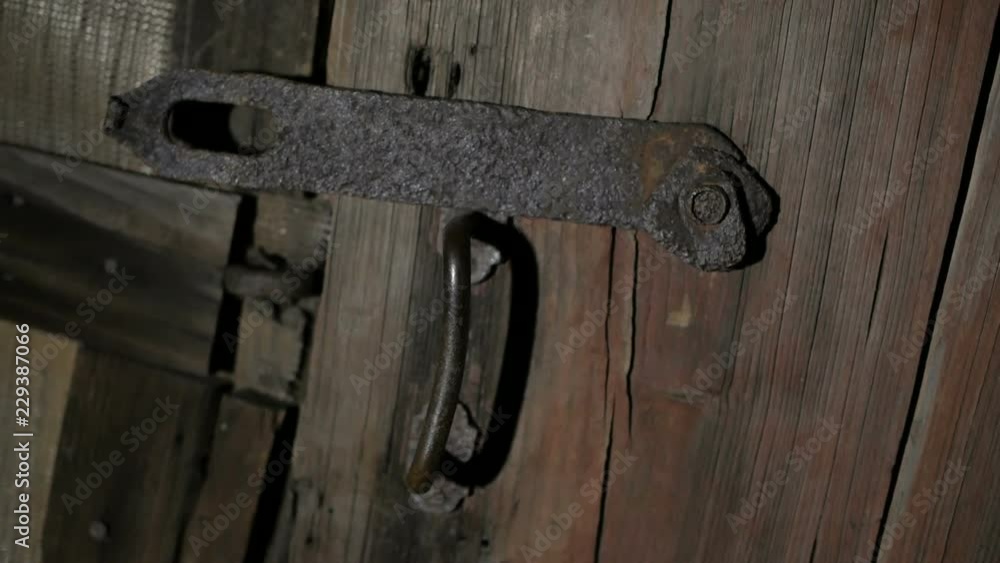 Wooden door to the old barn. Horror unknown behind the door. Wooden door to the old barn. Horror unknown behind the door.