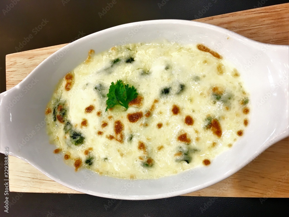 Baked Spinach with Cheese on dish  Italian food style