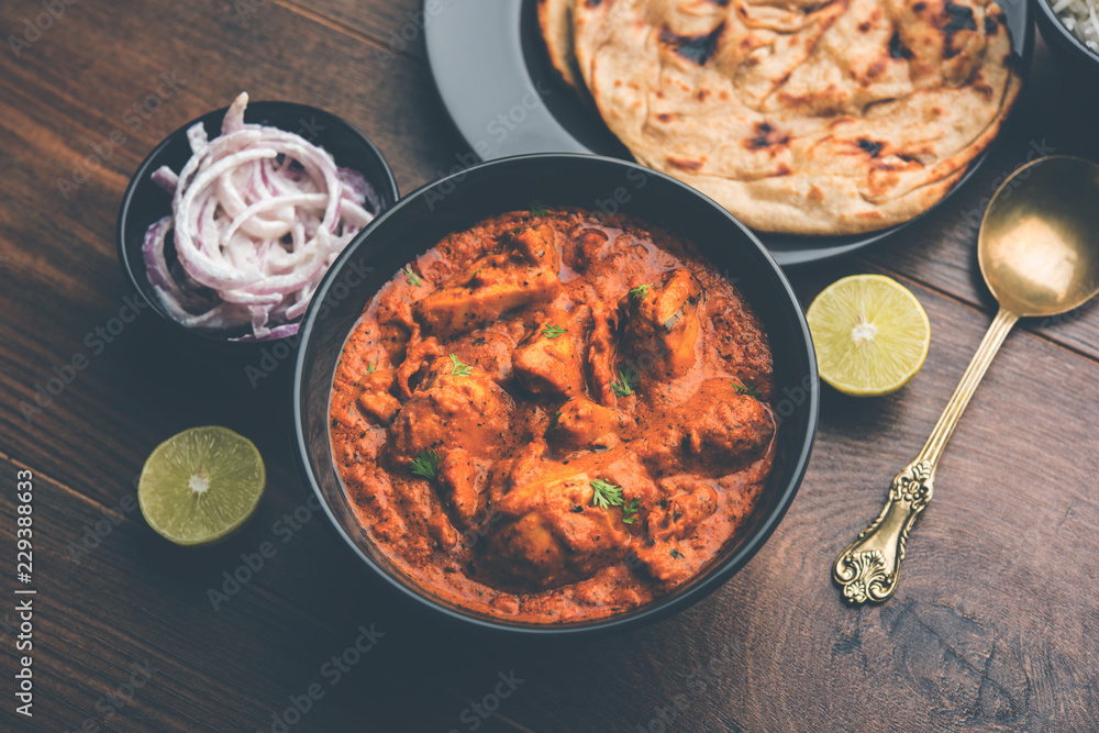Murgh Makhani / Butter chicken tikka masala served with roti / Paratha and plain rice along with